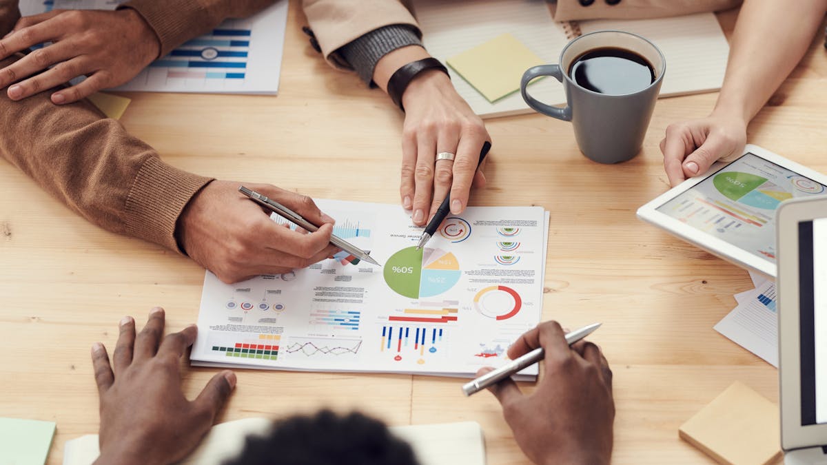 Investor analyzing property numbers — illustrative